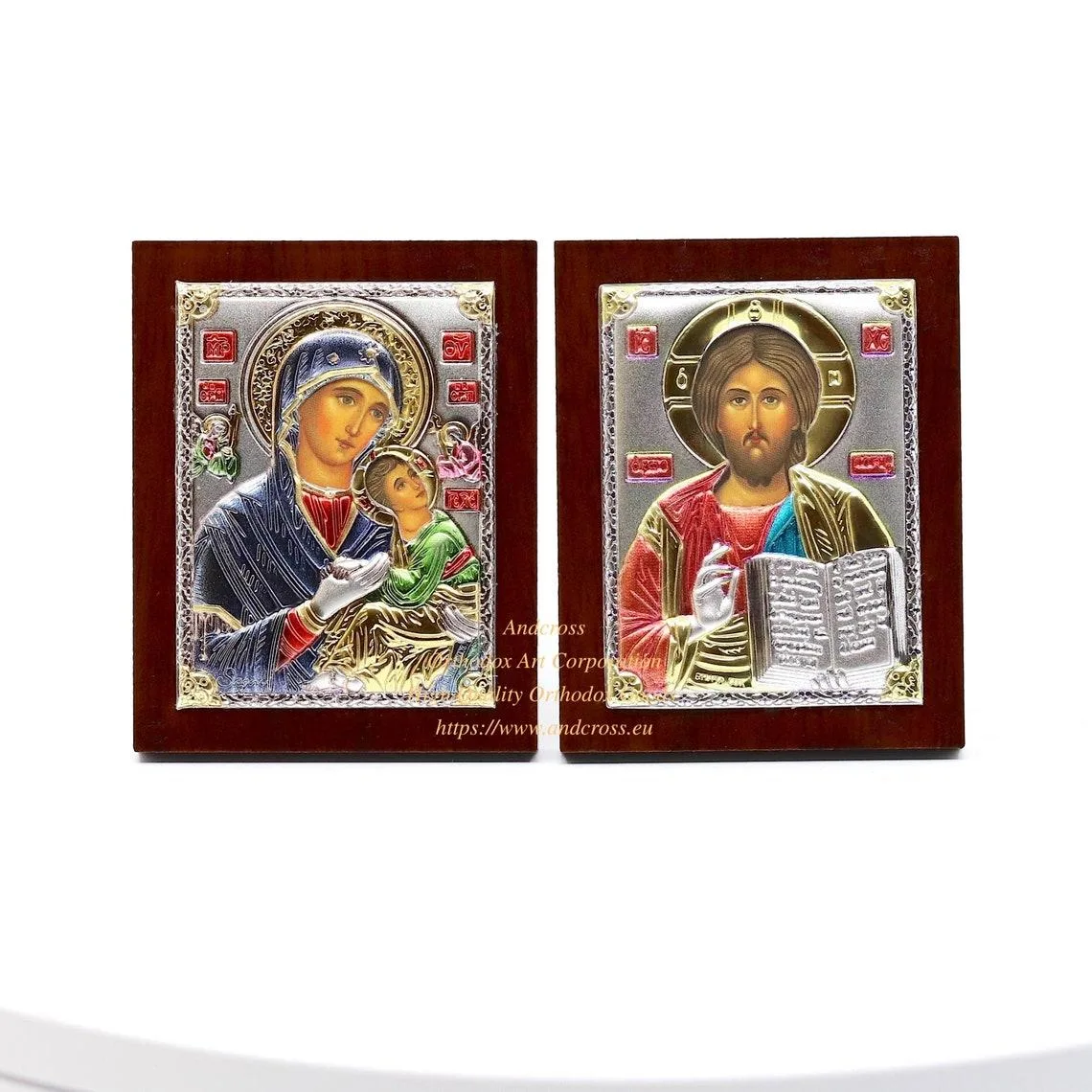 Two small silver-plated icons: Christ Pantocrator and the Amolyntos Mother of God