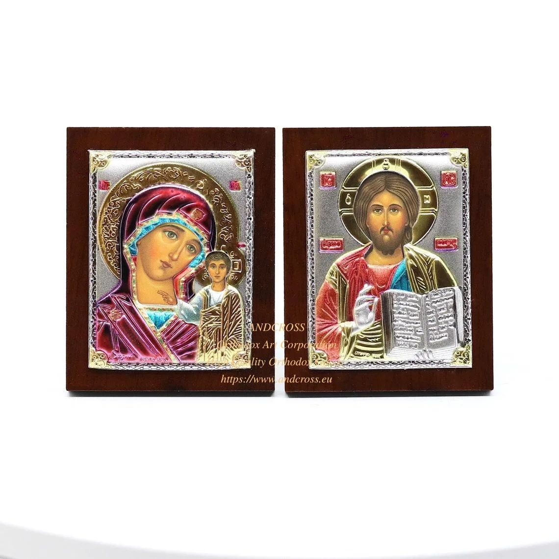Two small silver-plated icons: Christ Pantocrator and the Kazan Mother of God