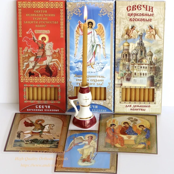 Wax church candles with a ceramic holder and laminated icon cards