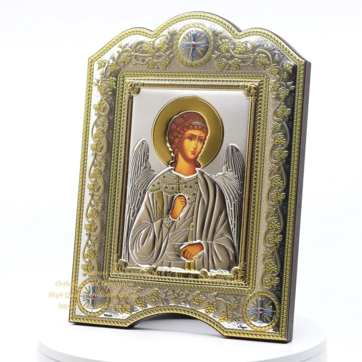 Guardian Angel icon in a silver- and gold-plated cover, framed under glass
