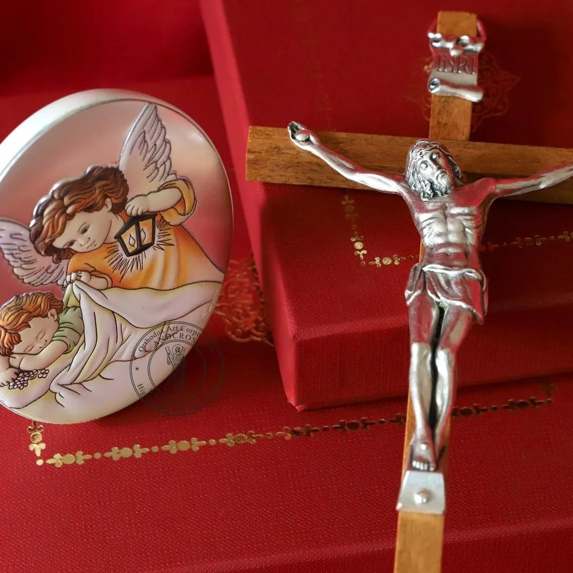 Silver-plated Guardian Angel with baby icon and a wall cross