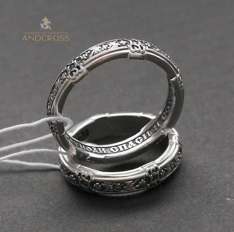 Thin sterling silver ring with a dove and ornament