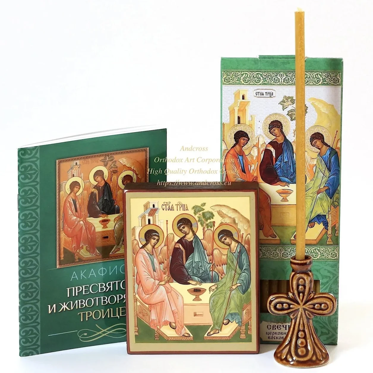 Holy Trinity icon set with wax candles and a ceramic holder