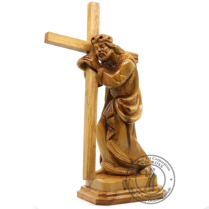 Hand-carved olive wood statue of Jesus carrying the cross