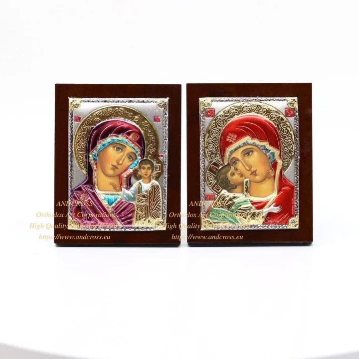 Two small silver-plated icons: the Kazan and the Vladimir Mother of God