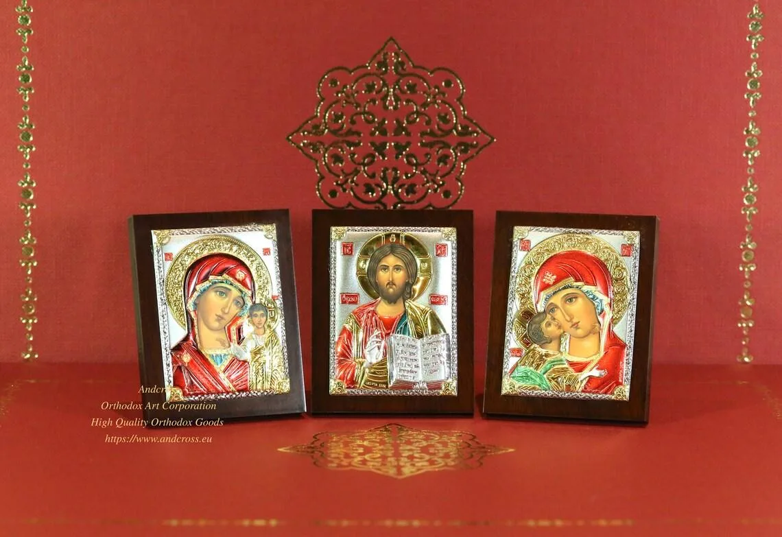 Three small silver-plated icons: the Lord Jesus Christ, the Kazan and the Vladimir Mother of God