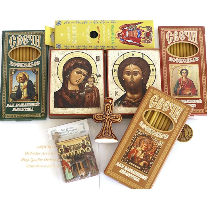Icons of the Saviour and the Kazan Mother of God with candles, incense and a holder