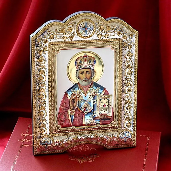 St Nicholas icon in a silver- and gold-plated cover, framed under glass