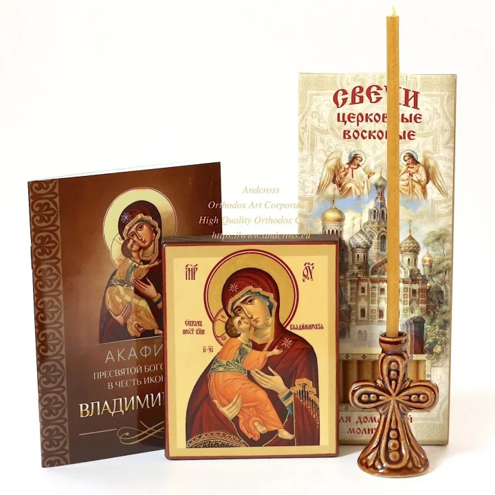 Vladimir Mother of God icon set with candles and a ceramic holder